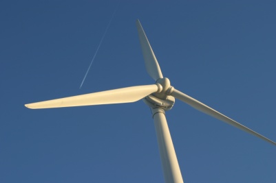 Windmill with aeroplane contrail