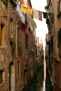 Laundry drying over a canal in Venice.